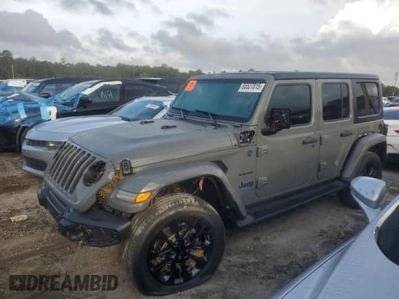 2023 Jeep Wrangler Sahara с VIN 1C4JJXP67PW605290, выставлен на аукционе Copart как лот 85527815 с пробегом Не указан миль и На запчасти • Non repairable. История ставок и продаж доступна на DreamBid. Изображение 1.
