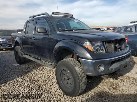 2005 Nissan Frontier Nismo with VIN 1N6AD07W65C406340, listed as a Copart auction lot 84442064 with 199,868 mi miles and Salvage title. Bid and sale history available at DreamBid. Image 4.