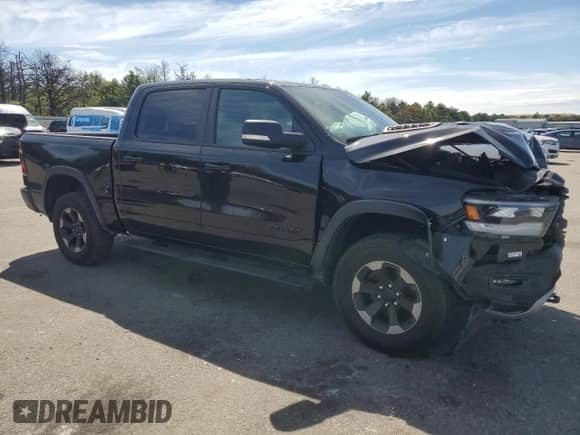2019 Ram 1500 Rebel with VIN 1C6SRFLT0KN698856, listed as a Copart auction lot 69225485 with 143,146 mi miles and Salvage title. Bid and sale history available at DreamBid. Image 4.