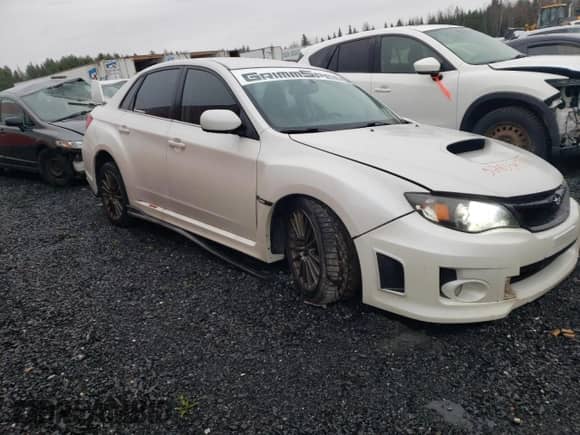 2012 Subaru WRX WRX Premium with VIN JF1GV7F64CG014358, listed as a Copart auction lot 52853435 with 208,501 mi miles and Salvage title. Bid and sale history available at DreamBid. Image 4.