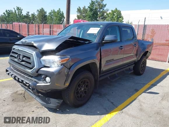 2022 Toyota Tacoma SR5 with VIN 3TMAZ5CN2NM174087, listed as a IAAI auction lot 43204600 with 68,360 mi miles and . Bid and sale history available at DreamBid. Image 17.