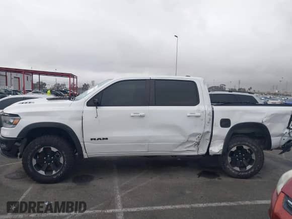 2022 Ram 1500 Rebel z VIN 1C6SRFLT4NN282636, wystawiony jako IAAI lot #43369975 z przebiegiem 38 884 mil mil oraz . Historia ofert i sprzedaży dostępna na DreamBid. Obrazek 14.