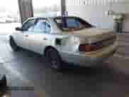 1994 Toyota Camry LE z VIN 4T1SK12EXRU336239, wystawiony jako IAAI lot #43305210 z przebiegiem 184 899 mil mil oraz . Historia ofert i sprzedaży dostępna na DreamBid. Obrazek 3.