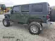 2007 Jeep Wrangler Unlimited Sahara z VIN 1J4GA59157L198095, wystawiony jako Copart lot #84028485 z przebiegiem 198 022 mil mil oraz Czysty tytuł • Clean title. Historia ofert i sprzedaży dostępna na DreamBid. Obrazek 2.