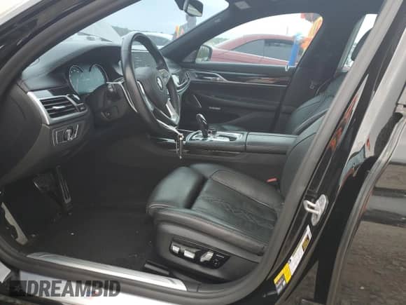 2018 BMW 7 Series 740e xDrive with VIN WBA7J2C59JB246238, listed as a Copart auction lot 53777335 with 76,642 mi miles and Salvage title. Bid and sale history available at DreamBid. Image 7.