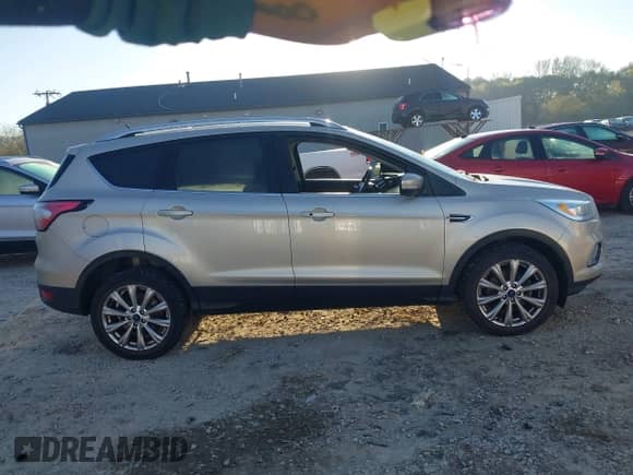 2017 Ford Escape Titanium with VIN 1FMCU0JD5HUC33262, listed as a IAAI auction lot 43427683 with 150,816 mi miles and . Bid and sale history available at DreamBid. Image 13.