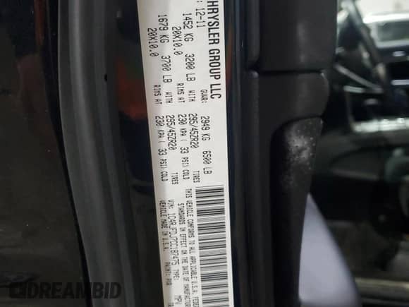 2012 Jeep Grand Cherokee SRT-8 z VIN 1C4RJFDJ7CC187475, wystawiony jako Copart lot #45191285 z przebiegiem 133 748 mil mil oraz Szkoda całkowita • Salvage title. Historia ofert i sprzedaży dostępna na DreamBid. Obrazek 13.