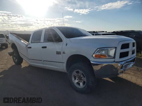 2010 Dodge 3500 ST with VIN 3D73Y3CL7AG194168, listed as a Copart auction lot 71197805 with 181,447 mi miles and Salvage title. Bid and sale history available at DreamBid. Image 4.