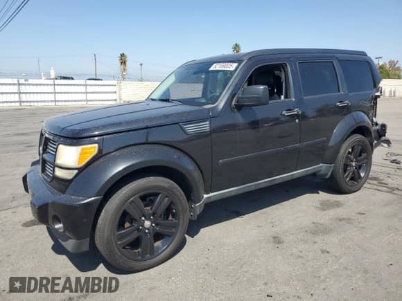 2011 Dodge Nitro Heat with VIN 1D4PT4GK8BW602815, listed as a Copart auction lot 82169005 with 126,700 mi miles and Salvage title. Bid and sale history available at DreamBid. Image 1.
