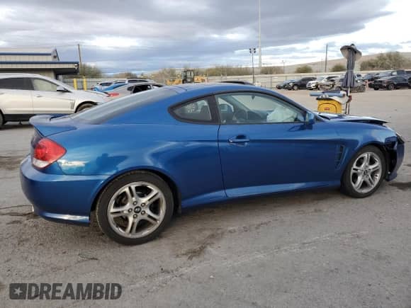 2005 Hyundai Tiburon GT с VIN KMHHN65F45U183144, выставлен на аукционе Copart как лот 87487994 с пробегом 59 582 миль миль и Списание • Salvage title. История ставок и продаж доступна на DreamBid. Изображение 3.