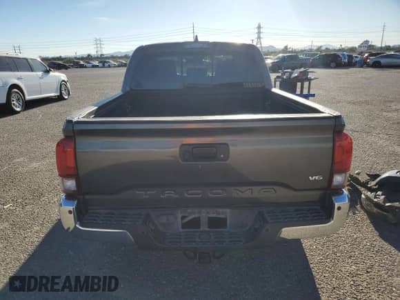 2018 Toyota Tacoma SR5 with VIN 3TMAZ5CN0JM053620, listed as a Copart auction lot 87210405 with 142,309 mi miles and Salvage title. Bid and sale history available at DreamBid. Image 6.