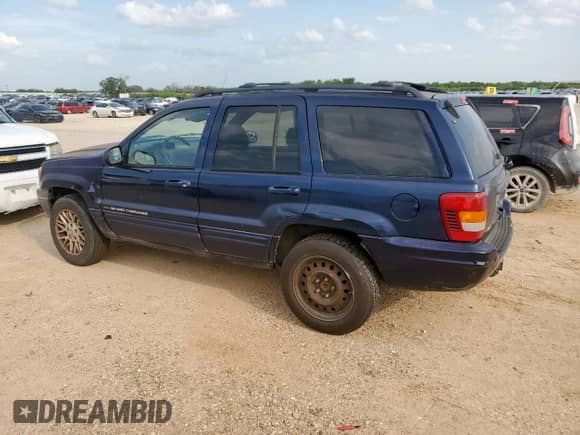 2004 Jeep Grand Cherokee with VIN 1J8GX58J54C121513, listed as a Copart auction lot 59384005 with 221,397 mi miles and Salvage title. Bid and sale history available at DreamBid. Image 2.