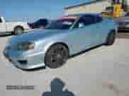 2006 Hyundai Tiburon GT с VIN KMHHN65F96U208668, выставлен на аукционе Copart как лот 50229835 с пробегом 123 075 миль миль и Чистый • Clean title. История ставок и продаж доступна на DreamBid. Изображение 1.