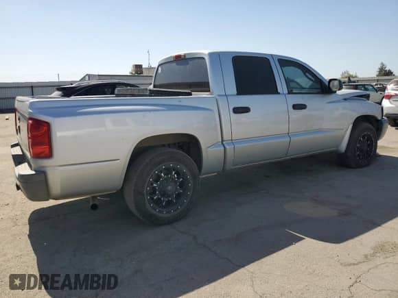 2007 Dodge Dakota z VIN 1D3HE28K57S191541, wystawiony jako Copart lot #73762424 z przebiegiem 184 274 mil mil oraz Szkoda całkowita • Salvage title. Historia ofert i sprzedaży dostępna na DreamBid. Obrazek 3.