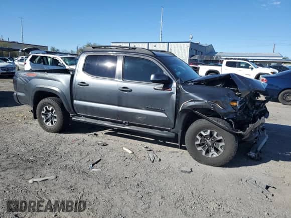 2021 Toyota Tacoma TRD Off Road with VIN 3TMCZ5AN4MM424715, listed as a Copart auction lot 86407685 with 55,946 mi miles and Salvage title. Bid and sale history available at DreamBid. Image 4.