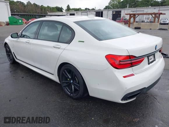 2017 BMW 7 Series 740e xDrive with VIN WBA7J2C30HG497919, listed as a IAAI auction lot 42717924 with 123,946 mi miles and . Bid and sale history available at DreamBid. Image 3.