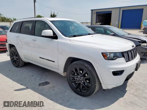 2020 Jeep Grand Cherokee Laredo E with VIN 1C4RJEAG0LC145362, listed as a Copart auction lot 71838285 with 59,381 mi miles and Salvage title. Bid and sale history available at DreamBid. Image 4.