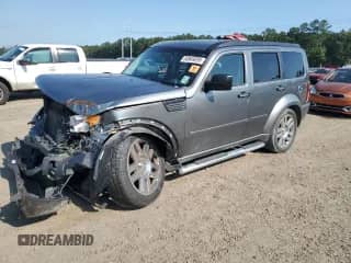 2011 Dodge Nitro Heat with VIN 1D4PT4GX7BW606656, listed as a Copart auction lot 58949295 with 95,496 mi miles and Salvage title. Bid and sale history available at DreamBid. Image 1.