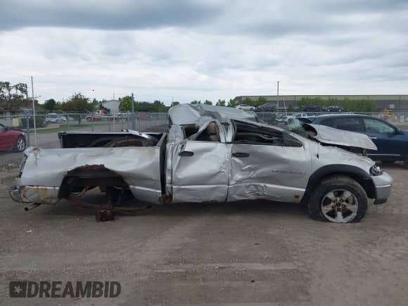 2004 Dodge 1500 SLT z VIN 1D7HU18NX4J260120, wystawiony jako IAAI lot #43109145 z przebiegiem 292 347 mil mil oraz . Historia ofert i sprzedaży dostępna na DreamBid. Obrazek 14.