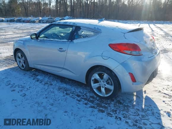 2012 Hyundai Veloster w/Gray Int z VIN KMHTC6AD0CU034568, wystawiony jako IAAI lot #41460659 z przebiegiem 141 826 mil mil oraz . Historia ofert i sprzedaży dostępna na DreamBid. Obrazek 3.