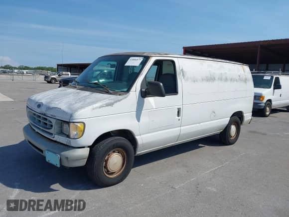 1999 Ford Econoline Cargo with VIN 1FTRE1428XHA20390, listed as a IAAI auction lot 41806875 with 207,954 mi miles and . Bid and sale history available at DreamBid. Image 2.