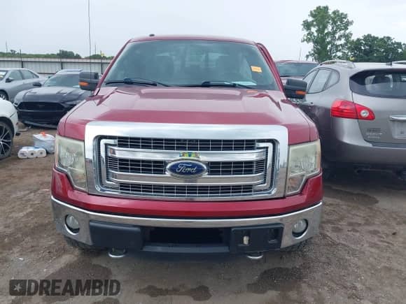 2013 Ford F-150 Lariat with VIN 1FTFW1ET0DKG07088, listed as a IAAI auction lot 42671190 with 202,968 mi miles and . Bid and sale history available at DreamBid. Image 12.