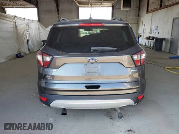 2018 Ford Escape SE z VIN 1FMCU9GD2JUC88494, wystawiony jako Copart lot #81230705 z przebiegiem 73 359 mil mil oraz Szkoda całkowita • Salvage title. Historia ofert i sprzedaży dostępna na DreamBid. Obrazek 6.