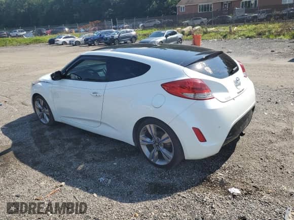 2012 Hyundai Veloster w/Red Int z VIN KMHTC6AD5CU058901, wystawiony jako Copart lot #69244165 z przebiegiem 97 260 mil mil oraz Szkoda całkowita • Salvage title. Historia ofert i sprzedaży dostępna na DreamBid. Obrazek 2.