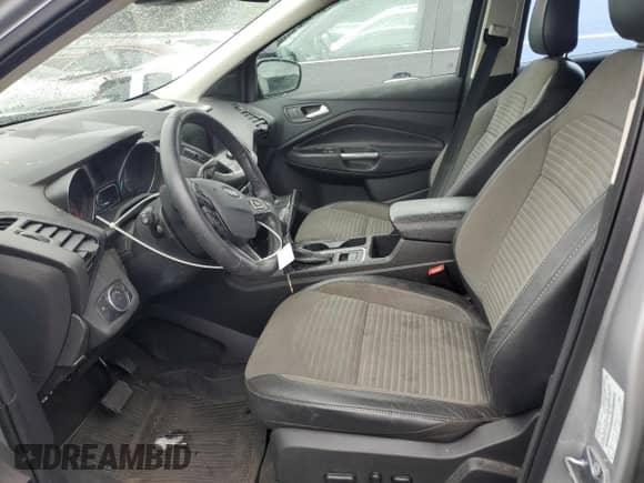 2018 Ford Escape SE z VIN 1FMCU9GD1JUC27881, wystawiony jako Copart lot #66502025 z przebiegiem 86 097 mil mil oraz Szkoda całkowita • Salvage title. Historia ofert i sprzedaży dostępna na DreamBid. Obrazek 7.