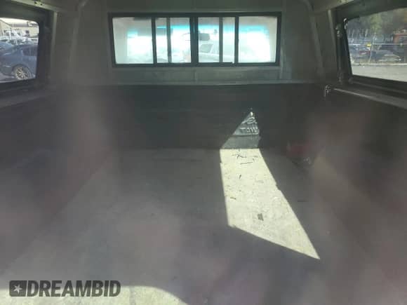 1994 Dodge Dakota z VIN 1B7GG26X3RS605626, wystawiony jako Copart lot #75293854 z przebiegiem 159 432 mil mil oraz Szkoda całkowita • Salvage title. Historia ofert i sprzedaży dostępna na DreamBid. Obrazek 10.