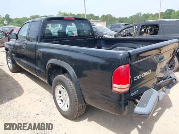 2003 Dodge Dakota with VIN 1D7HL12X73S381323, listed as a IAAI auction lot 42161329 with 219,083 mi miles and . Bid and sale history available at DreamBid. Image 3.