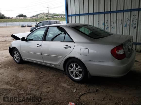 2004 Toyota Camry LE z VIN 4T1BF30KX4U569944, wystawiony jako Copart lot #81707915 z przebiegiem 246 068 mil mil oraz Szkoda całkowita • Salvage title. Historia ofert i sprzedaży dostępna na DreamBid. Obrazek 2.