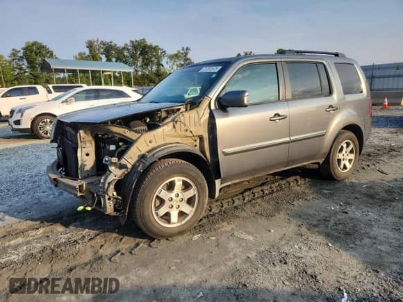 2009 Honda Pilot Touring with VIN 5FNYF38829B016406, listed as a Copart auction lot 71791575 with 221,923 mi miles and Salvage title. Bid and sale history available at DreamBid. Image 1.