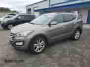 2013 Hyundai Santa Fe Sport z VIN 5XYZUDLAXDG023986, wystawiony jako Copart lot #82571675 z przebiegiem 135 856 mil mil oraz Czysty tytuł • Clean title. Historia ofert i sprzedaży dostępna na DreamBid. Obrazek 1.