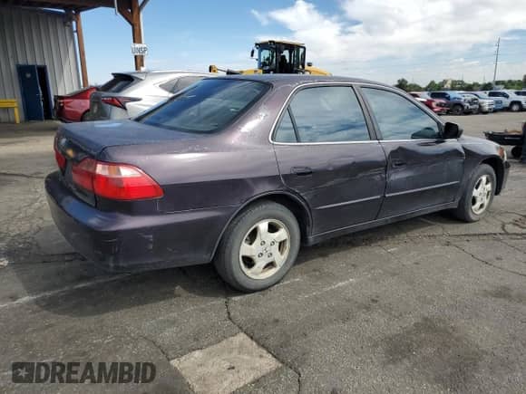 1999 Honda Accord EX with VIN 1HGCG5657XA055401, listed as a Copart auction lot 80711785 with 184,096 mi miles and Salvage title. Bid and sale history available at DreamBid. Image 3.
