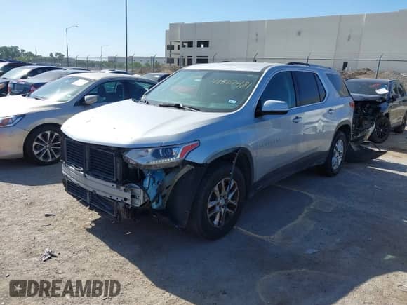 2018 Chevrolet Traverse LT Cloth z VIN 1GNERGKW0JJ153194, wystawiony jako IAAI lot #42827481 z przebiegiem 124 559 mil mil oraz . Historia ofert i sprzedaży dostępna na DreamBid. Obrazek 2.