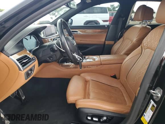 2019 BMW 7 Series 750i with VIN WBA7F0C53KGM25904, listed as a Copart auction lot 64657215 with 48,995 mi miles and Salvage title. Bid and sale history available at DreamBid. Image 7.