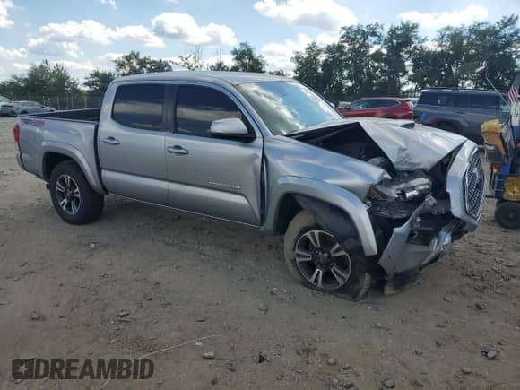 2019 Toyota Tacoma SR with VIN 3TMCZ5AN3KM279924, listed as a Copart auction lot 70306975 with 135,344 mi miles and Salvage title. Bid and sale history available at DreamBid. Image 4.