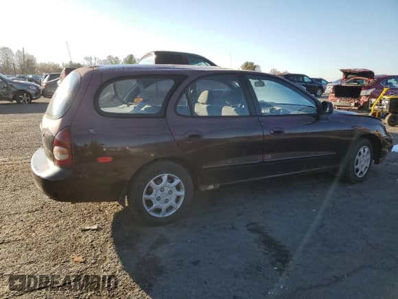 1999 Hyundai Elantra с VIN KMHJW25F1XU128645, выставлен на аукционе Copart как лот 82970984 с пробегом 118 048 миль миль и Списание • Salvage title. История ставок и продаж доступна на DreamBid. Изображение 3.