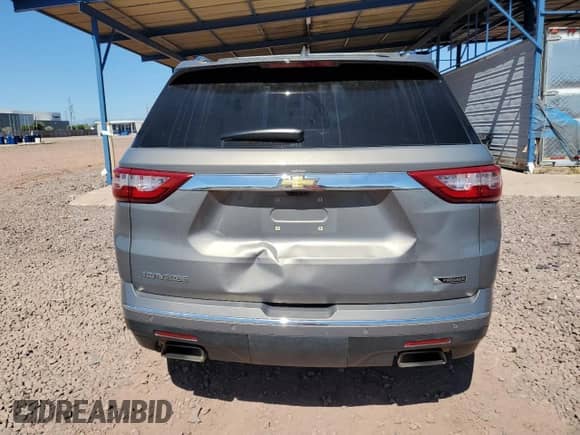 2018 Chevrolet Traverse Premier с VIN 1GNERKKWXJJ137281, выставлен на аукционе Copart как лот 84072725 с пробегом 119 794 миль миль и Списание • Salvage title. История ставок и продаж доступна на DreamBid. Изображение 6.
