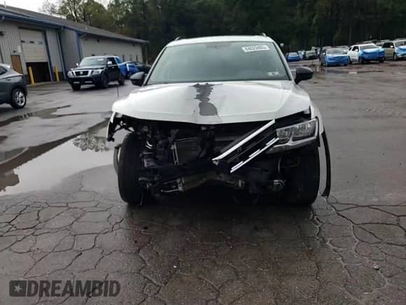 2021 Volkswagen Tiguan SE с VIN 3VV2B7AX7MM030303, выставлен на аукционе Copart как лот 84023485 с пробегом 94 482 миль миль и Списание • Salvage title. История ставок и продаж доступна на DreamBid. Изображение 14.