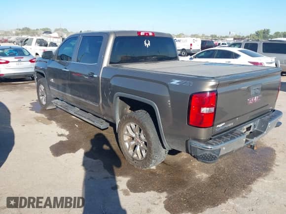2015 GMC Sierra 1500 SLT z VIN 3GTU2VECXFG151220, wystawiony jako IAAI lot #43487605 z przebiegiem 128 617 mil mil oraz . Historia ofert i sprzedaży dostępna na DreamBid. Obrazek 3.