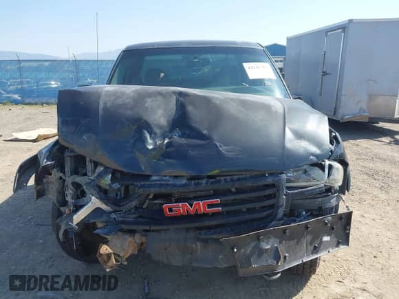2003 GMC Sierra 1500 SLT z VIN 1GTEK19T03E191705, wystawiony jako IAAI lot #42145392 z przebiegiem Nie podano mil oraz . Historia ofert i sprzedaży dostępna na DreamBid. Obrazek 13.