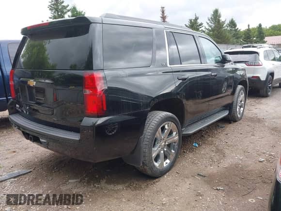 2018 Chevrolet Tahoe LT z VIN 1GNSKBKC9JR254896, wystawiony jako IAAI lot #42456940 z przebiegiem 102 459 mil mil oraz . Historia ofert i sprzedaży dostępna na DreamBid. Obrazek 4.