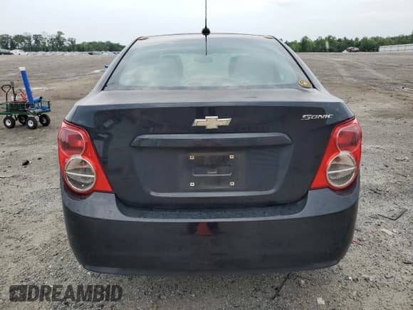 2015 Chevrolet Sonic LS with VIN 1G1JB5SG0F4210338, listed as a Copart auction lot 63960604 with 210,499 mi miles and Salvage title. Bid and sale history available at DreamBid. Image 6.