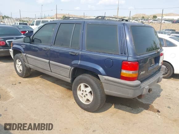1994 Jeep Grand Cherokee Laredo with VIN 1J4GZ58Y7RC233746, listed as a IAAI auction lot 42722206 with 196,875 mi miles and . Bid and sale history available at DreamBid. Image 3.