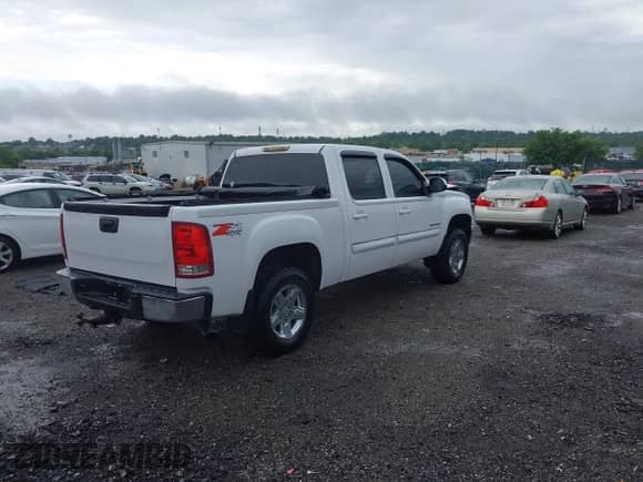 2010 GMC Sierra 1500 SLT with VIN 3GTRKWE33AG148664, listed as a IAAI auction lot 42459596 with 154,739 mi miles and . Bid and sale history available at DreamBid. Image 4.