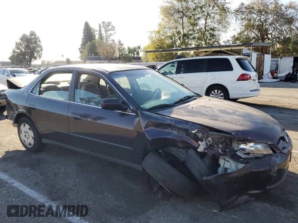 1999 Honda Accord LX with VIN 1HGCG1641XA012320, listed as a Copart auction lot 42543715 with 187,314 mi miles and Salvage title. Bid and sale history available at DreamBid. Image 4.