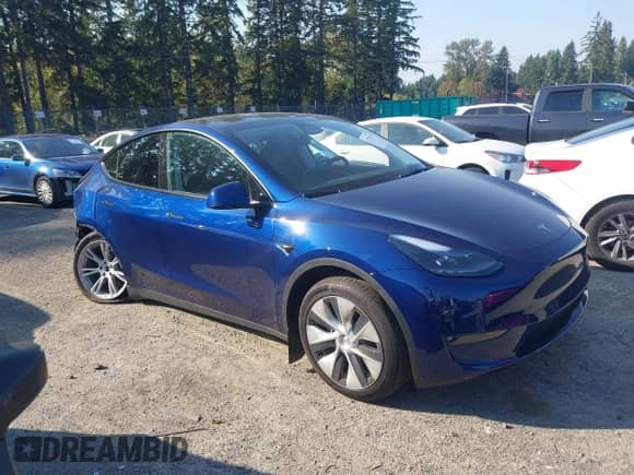2023 Tesla Model Y Long Range with VIN 7SAYGDEE3PF957974, listed as a IAAI auction lot 43275987 with 20,712 mi miles and . Bid and sale history available at DreamBid. Image 13.