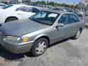 1997 Toyota Camry LE z VIN JT2BF22K6V0076534, wystawiony jako IAAI lot #42648829 z przebiegiem 258 244 mil mil oraz . Historia ofert i sprzedaży dostępna na DreamBid. Obrazek 2.